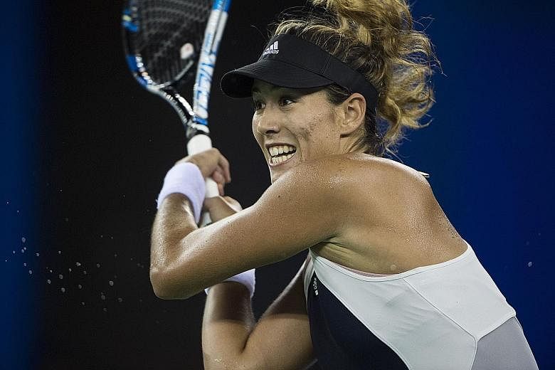 Garbine Muguruza returning a shot during her win over Serbia's Ana Ivanovic at the Wuhan Open yesterday. The Spaniard has a good chance of playing at the WTA Finals in Singapore if she maintains her winning momentum.
