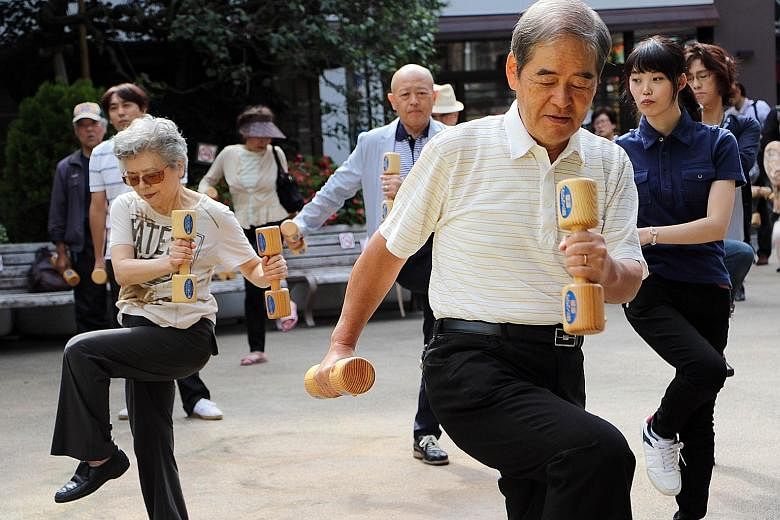A group of seniors exercising in Tokyo. A 2011 study in Britain found that, after deducting pensions, welfare and healthcare, older people contributed £44 billion (S$95 billion) to society in terms of taxes and spending, among other things.