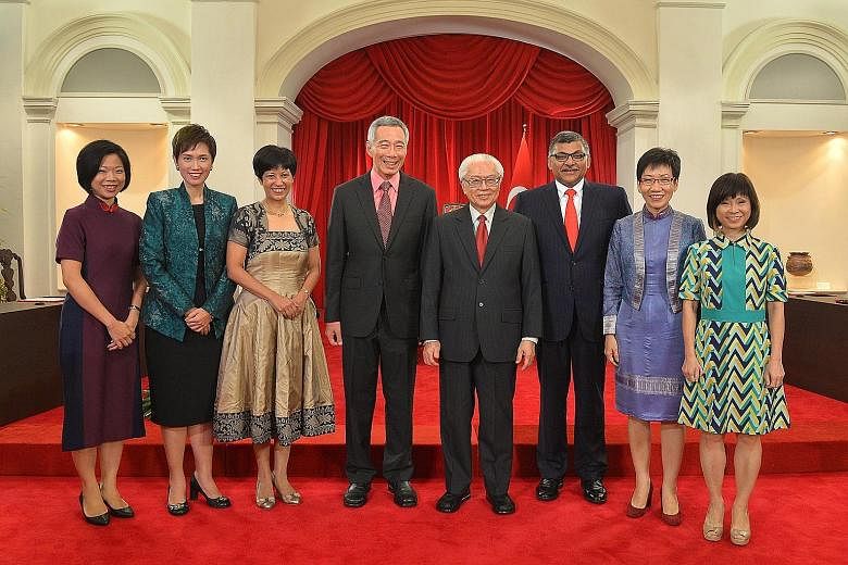 (From left) Ms Sim Ann, Mrs Josephine Teo, Ms Indranee Rajah, PM Lee Hsien Loong, President Tony Tan, Chief Justice Sundaresh Menon, Ms Grace Fu and Dr Amy Khor after the swearing-in ceremony yesterday.