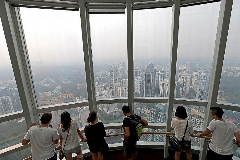 The view of the city from the Ion Sky observation deck. Overseas buyers traditionally add to demand for more expensive homes, including those in the central region and city fringes but their share of purchases has been on the decline.