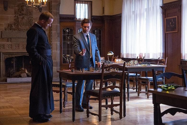 Tobey Maguire (left) as Bobby Fischer, with Peter Sarsgaard (far left) as William Lombardy, a priest and chess grandmaster, in Pawn Sacrifice.