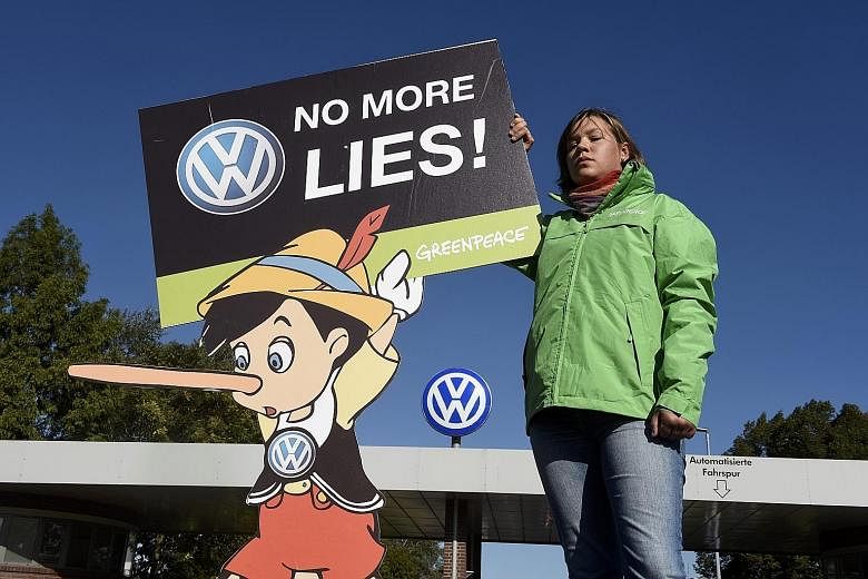 A Greenpeace activist protesting in front of Volkswagen's factory in Wolfsburg, Germany, last month over the carmaker's emissions scandal.