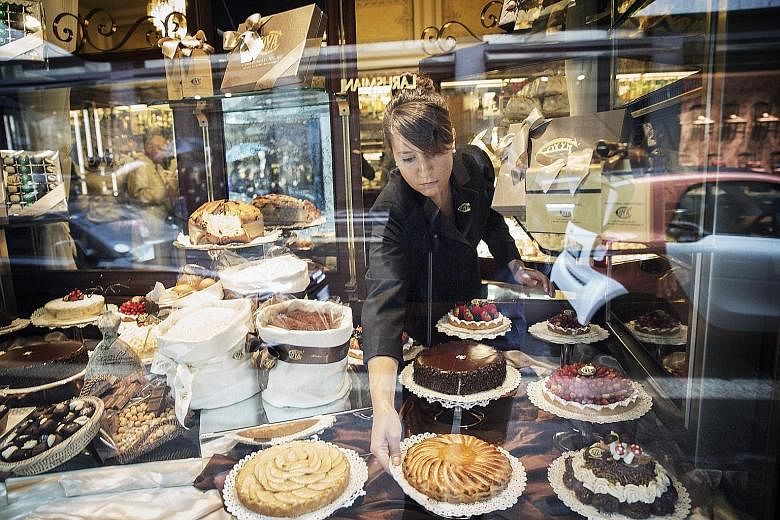 Pastries in a window facing the street at Cova Caffe, owned by LVMH Moet Hennessy Louis Vuitton, in Milan, Italy.