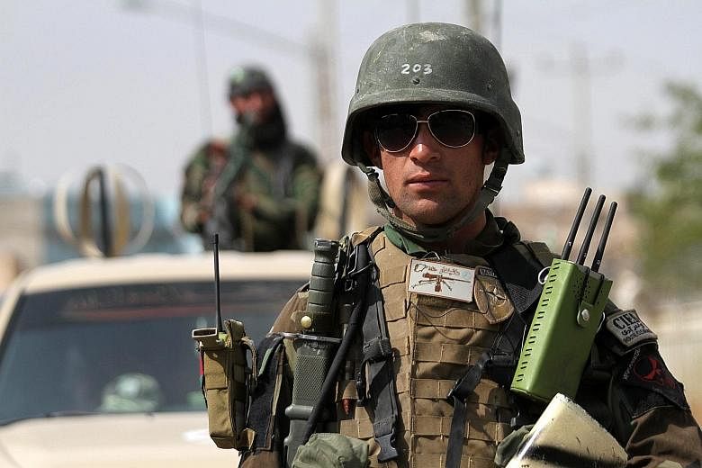 The Taleban's success in Kunduz marked a blow for Afghanistan's Nato-trained forces (left), who have largely been fighting on their own since December.