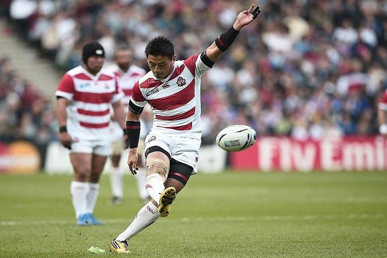 Japan's full-back Ayumu Goromaru kicking a penalty during their Pool B tie against Samoa at the Rugby World Cup in Milton Keynes, north of London yesterday. He scored 16 points to add to two tries as Japan won 26-5 to earn their second win and keep a