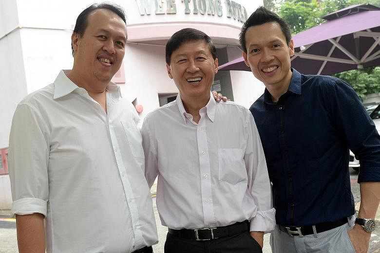 Wee Tiong Holdings founder Tan Siong Kern (centre), with his sons Wee Tiong (left), the firm's finance director, and Wee Beng, its chief executive. Mr Tan Wee Beng had initially planned to pursue an engineering career, but acceded to his father's req