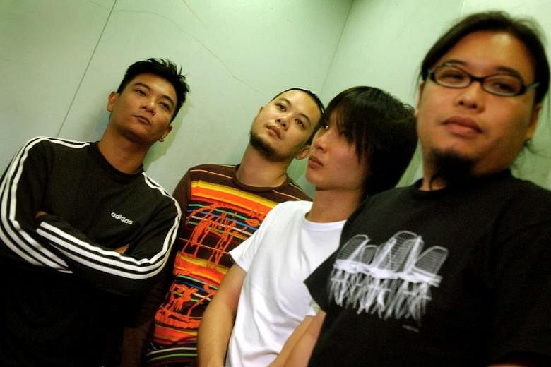 Mr Pann Lim (right) in 2006 with members of Singapore indie rock band Concave Scream (from left) Dean Aziz, Andy Yang and Sean Lam. 