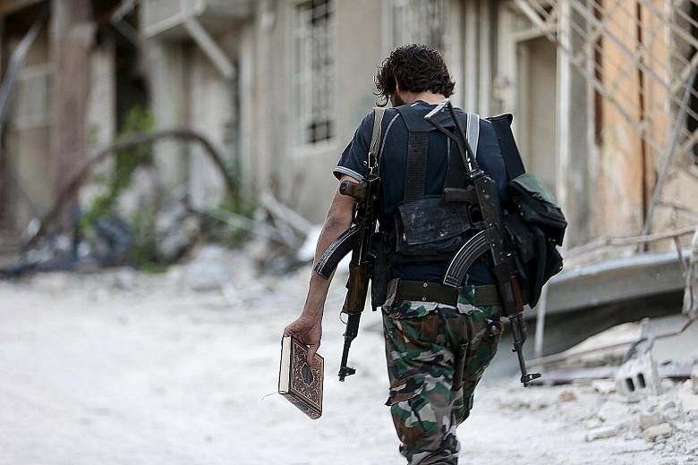 A Free Syrian Army fighter in Jobar, a suburb of Damascus in Syria.