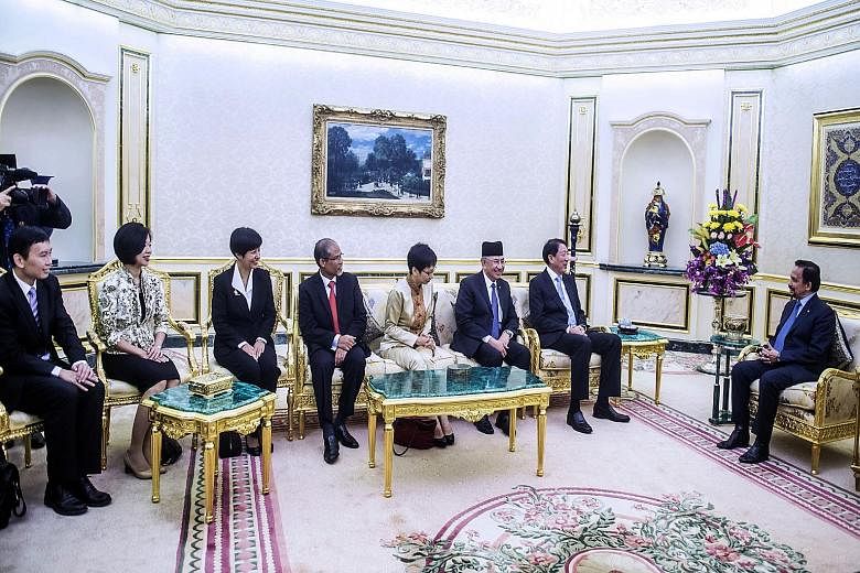 (From right) Brunei Sultan Hassanal Bolkiah with Singapore Deputy Prime Minister and Coordinating Minister for National Security Teo Chee Hean; Brunei Second Minister of Finance Pehin Haji Abdul Rahman; Singapore Minister for Culture, Community and Y