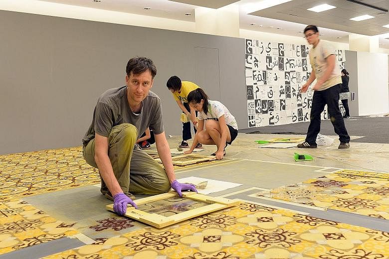 French artist Laurent Mareschal (above) uses spices to create floor tiles which are based on Islamic geometric patterns.