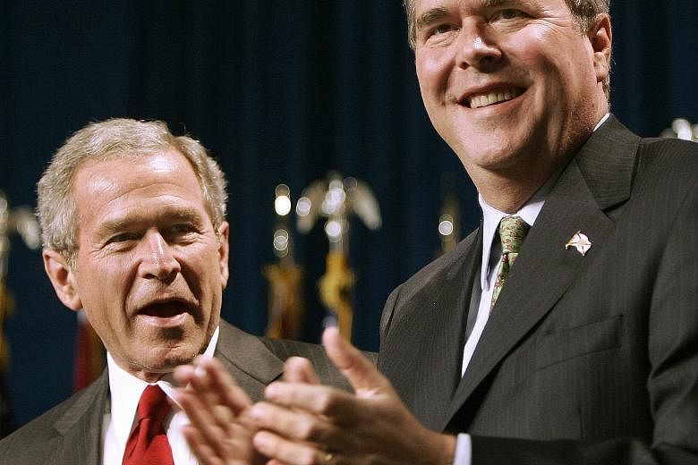 Republican presidential hopeful Jeb Bush (right) with his brother, former president George W. Bush, in a 2006 photo.
