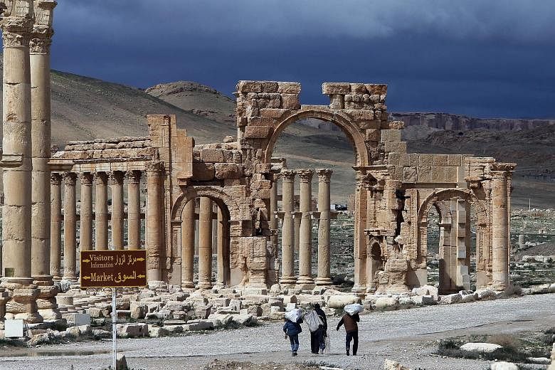 A picture taken on March 14 last year of Palmyra's famous Arch of Triumph, which ISIS militants are said to have destroyed on Sunday. Syrian antiquities director Maamun Abdulkarim warned of a catastrophe at the Unesco-listed World Heritage site and s