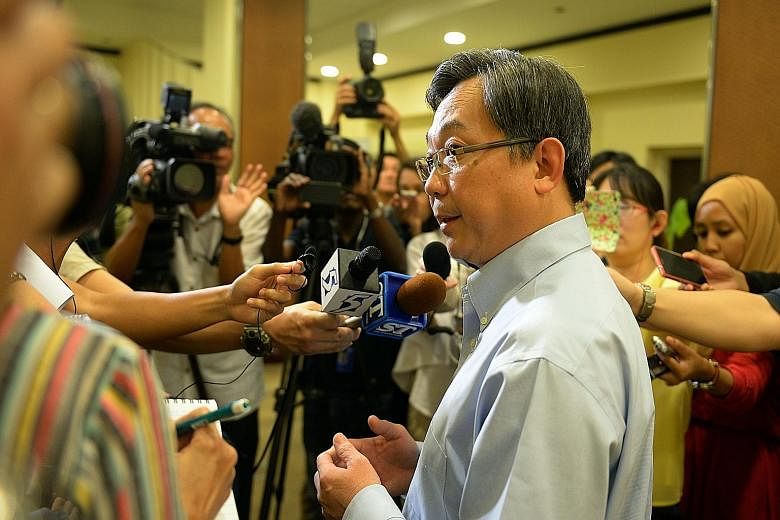 Health Minister Gan Kim Yong speaking to the media yesterday. The ministry has convened an independent review committee to scrutinise SGH's internal investigations and findings, and will look for gaps or potential weaknesses in the current infection 