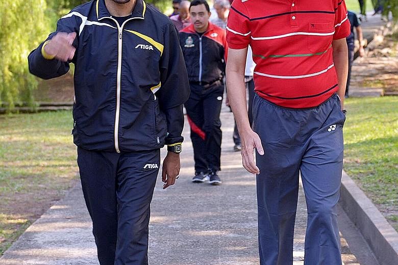 Mr Teo Chee Hean and His Royal Highness Crown Prince Al-Muhtadee Billah of Brunei having a morning walk at the Berakas Forest Reserve yesterday. Crown Prince Billah hosted DPM Teo and his delegation to breakfast thereafter.