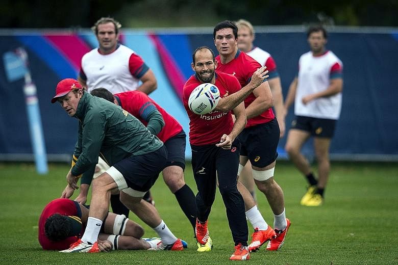 South Africa's scrum-half and captain Fourie du Preez passing the ball during a training session. The Springboks are attempting to become the first team to win the World Cup after a defeat in the pool stage. They were shocked 34-32 by the Japanese in