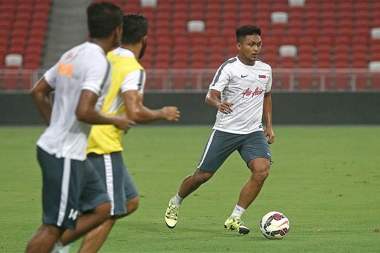 Above: Midfielder Izzdin Shafiq cutting a lean and mean figure during training at the National Stadium last night. Left: Two years ago, the 1.76m-tall Izzdin was a little chubby but has now lost 9kg. He weighs 78kg.