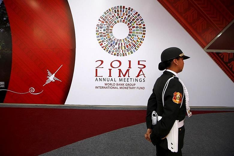 A Peruvian policewoman at the venue of the IMF/World Bank meetings in Lima. The IMF advised emerging markets to be ready for the US to tighten monetary policy and urged advanced economies to address "crisis legacies".