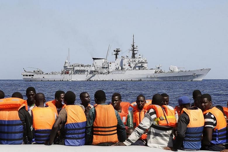 Sub-Saharan migrants being transported to an Italian Navy ship in the southern Mediterranean Sea last month.
