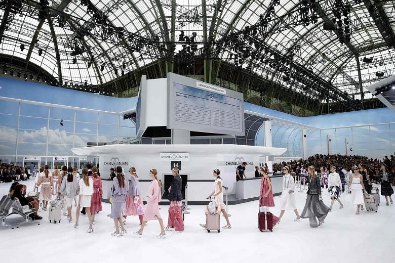 The Chanel spring/ summer 2016 collection is presented in a mock airport departure lounge (above), with Kendall Jenner as one of the models.