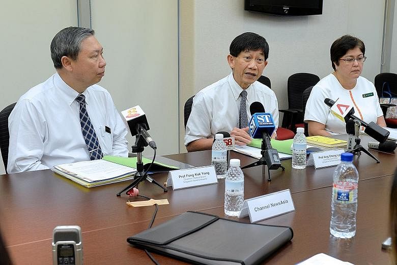 (From left) Professors Fong Kok Yong and Ang Chong Lye at a media briefing on Tuesday. SGH has promised to pay for all the treatment that patients who were infected with hepatitis C at the hospital's renal ward will need to overcome it.