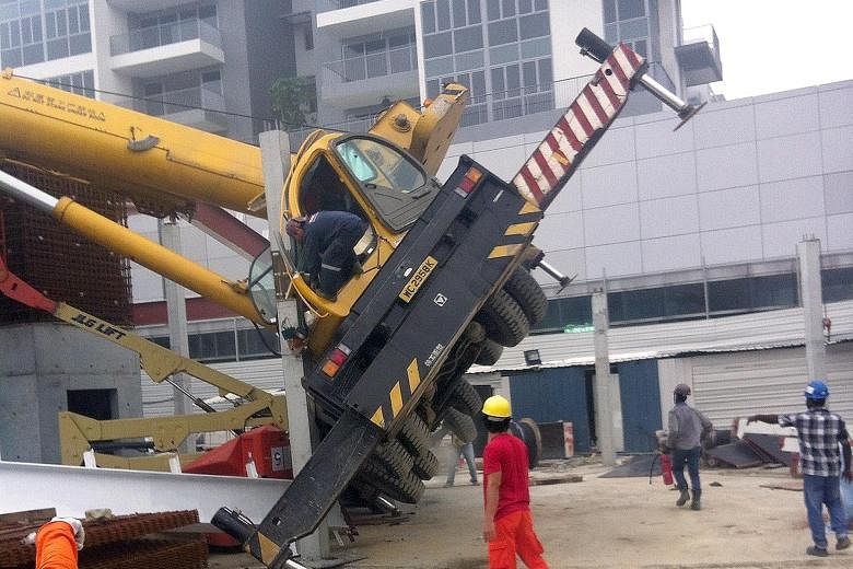 A crane toppled in Bedok on Tuesday, one of two incidents that day. There were 17 crane-related accidents in the first eight months of this year.