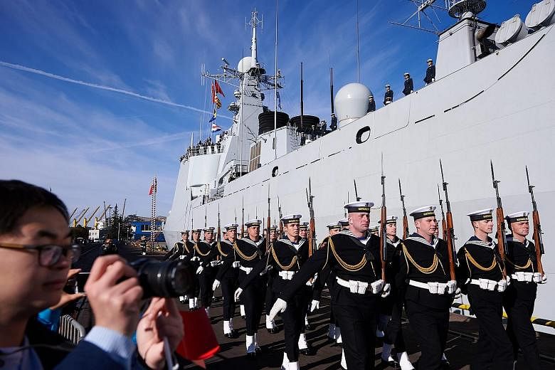 Polish Navy personnel marching at a welcome ceremony for Chinese Navy ships in the port of Gdynia in Poland yesterday. Three Chinese naval vessels - Jinan, a destroyer; Yiyang, a multi-role frigate; and Qiandaohu, a replenishment ship - sailed into G