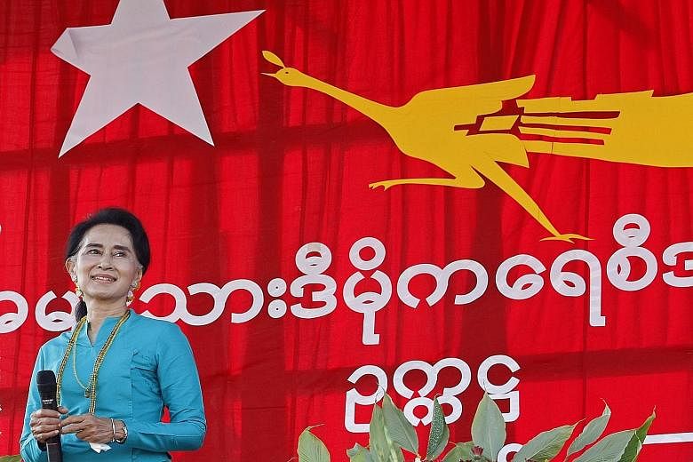Myanmar opposition leader Aung San Suu Kyi taking to the stage during her election campaign in Moe Nyin, Kachin State, on Sunday. "The leader of the NLD government would have to be me, because I'm the leader of my party," she said in an interview.