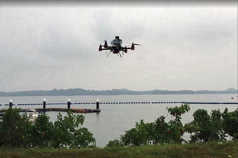 A SingPost drone prototype on a delivery trial on Sept 25, which was touted as the world's first successful test by a postal service provider. The drone flew 2km between Lorong Halus and Pulau Ubin, carrying a letter and a T-shirt in a packet. It has