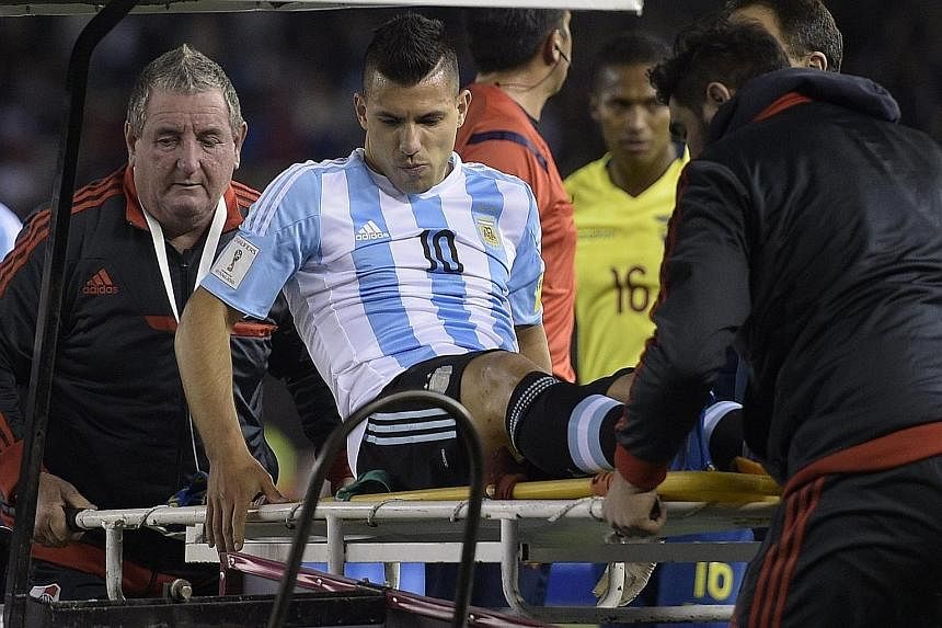 Above: The injury suffered by Sergio Aguero, who scored five goals for Manchester City against Newcastle last Saturday, means that the striker will not play in Argentina's match against Paraguay on Tuesday. Left: Chile's Eduardo Vargas (front), who s