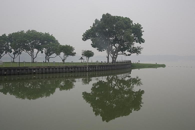 Kranji Reservoir shrouded in haze on Monday. Singapore should take the lead from the US that has laws to act against any errant firm that has a US connection.
