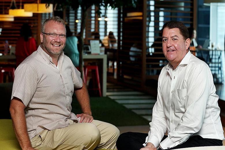 DBS chief innovation officer Neal Cross (left) says the bank is working with 145 tech start-ups and has created 120 new prototypes, while Swift's Asia-Pacific managing director, Mr Eddie Haddad, is exploring a larger role in the small-value, real-tim