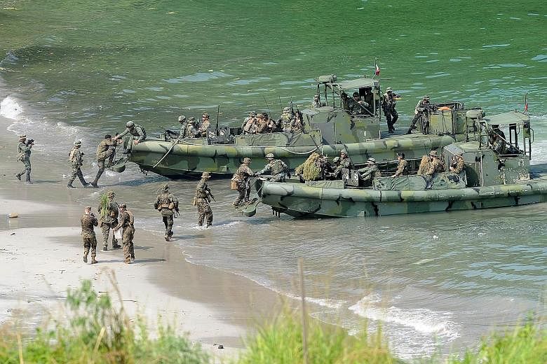 Philippine and US Marines during a beach landing drill as part of their annual joint naval exercise. The US is beefing up its role