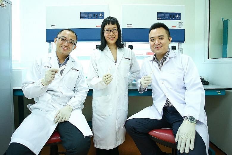 (From left) Dr Tan Eng Lee, Dr Lin Zhaoru and Dr Kevin Koh are part of a team of six working to make the HFMD kit user-friendly so it can be sold in pharmacies eventually.