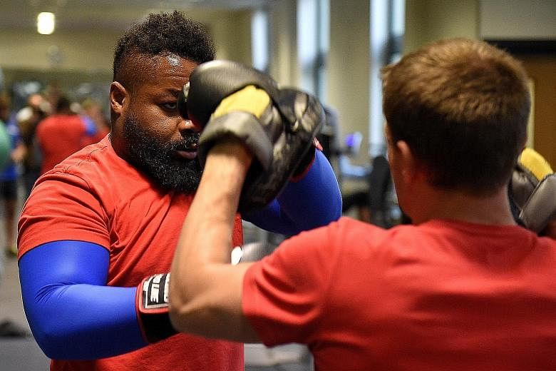 French centre Mathieu Bastareaud (left) during an indoor training session in Wales. France and Ireland want to win their clash to avoid the Kiwis.