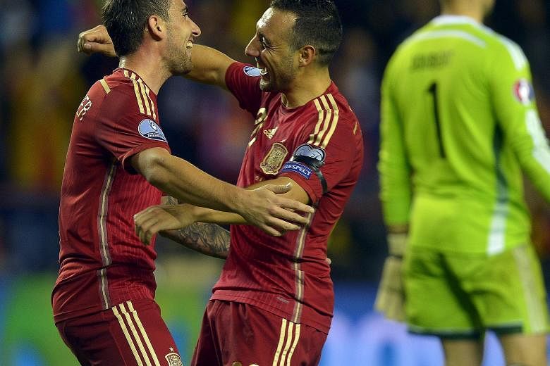 Paco Alcacer (far left) and Santi Cazorla each netted twice during Spain's 4-0 thrashing of Luxembourg in Logrono for the defending champions to qualify for Euro 2016.