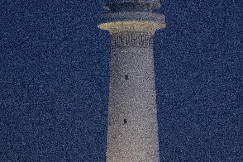 A lighthouse on Cuateron Reef pictured on Sept 9. This and another lighthouse on Johnson South Reef have been officially opened, China's state-run Xinhua news agency said last Friday.