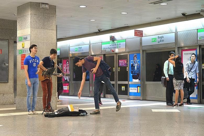One of the acts under the National Arts Council's busking scheme is The Unemployed, comprising Mr Ang Cheng Wei, who sings, and Mr Er Young Yee, who plays the guitar.