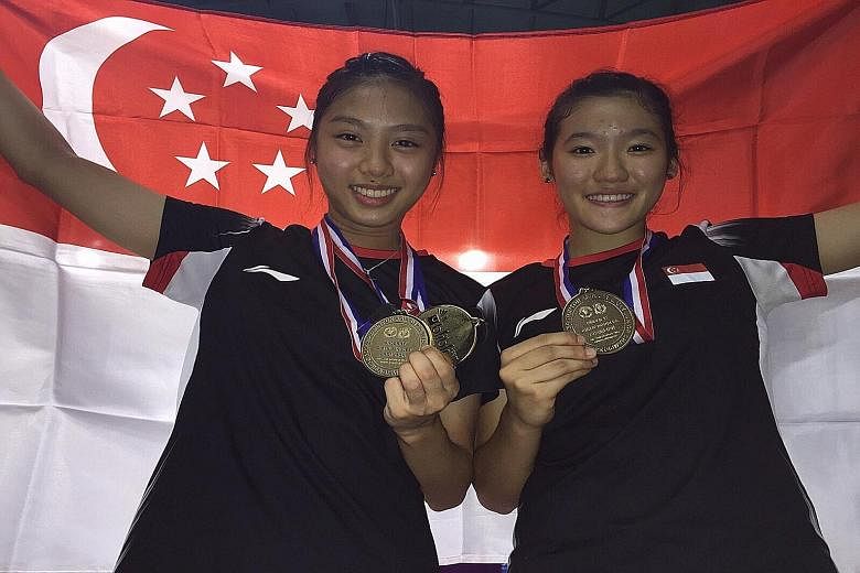 Yeo Jia Min (left) and Crystal Wong are all smiles after clinching the Asian U-17 girls' doubles title. Jia Min was given only an hour's rest after her singles win before going back on court.