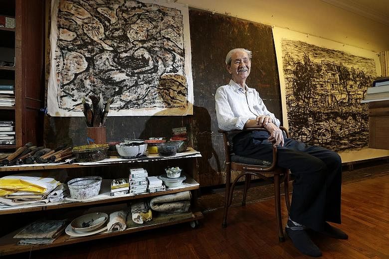 Artist Lim Tze Peng with some of his works in his home studio.