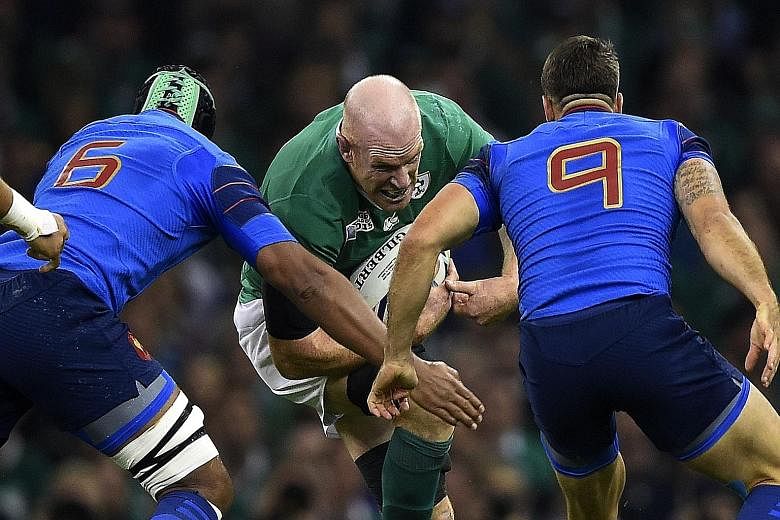 Ireland's captain, lock Paul O'Connell, taking on his France counterpart, flanker Thierry Dusautoir (left), and lock Yoann Maestri at the Millennium Stadium. While the Irish secured top spot in Pool D with a 24-9 win and avoid the All Blacks in the l