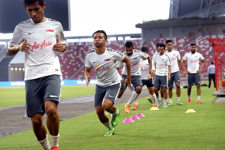The Lions training at the National Stadium yesterday for tonight's World Cup qualifier against Cambodia.