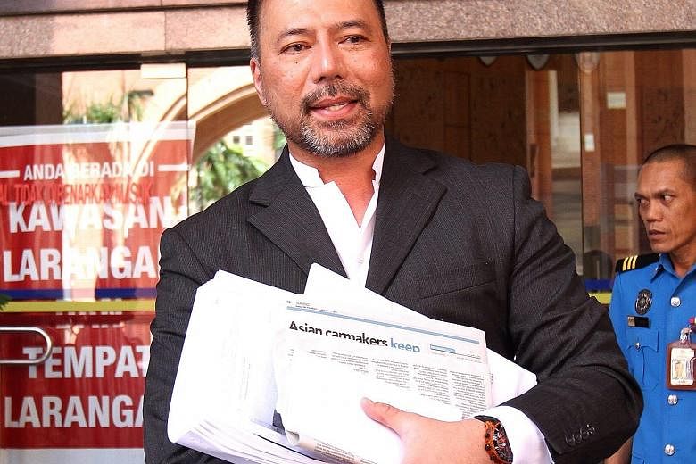 Khairuddin Abu Hassan (far left), a former Umno leader in Penang, had raised questions about 1MDB and alleged money flows involving PM Najib Razak. He and his lawyer Matthias Chang (left) had visited the authorities in several countries to call for p