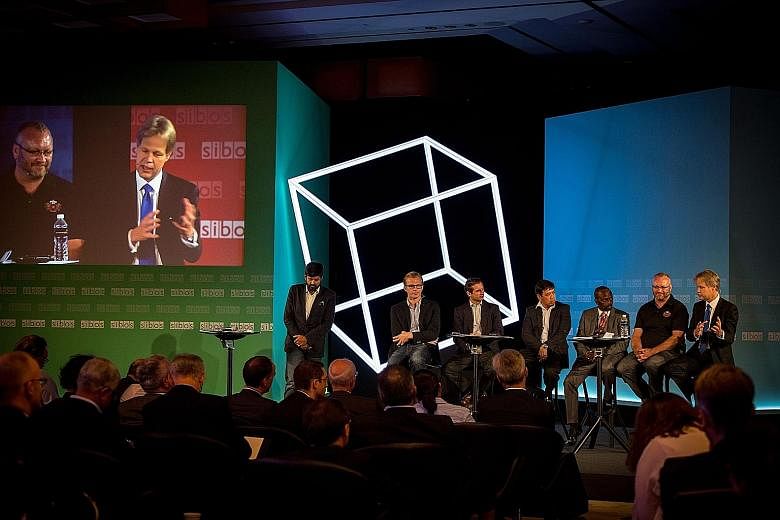 Exchanging views at a Sibos conference yesterday were (from far left) Apis Partners co-founder Udayan Goyal, Kreditech co-founder Alexander Graubner- Mueller, Iwoca chief executive Christoph Rieche, Cignifi Asia managing director Jojo Malolos, Mode c