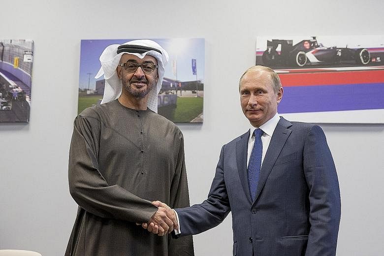 Mr Putin with Abu Dhabi’s Crown Prince Sheikh Mohammed Zayed Al Nahyan in Sochi on Sunday. 