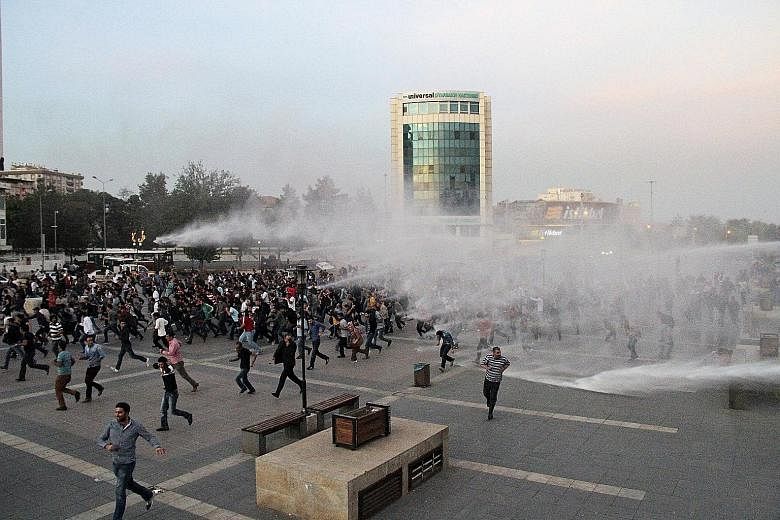 Police in Diyarbakir, Turkey, using tear gas and water cannon on Sunday to disperse protesters rallying against the double suicide bombing in Ankara that killed 97 people, according to official estimates. The deadliest attack in Turkey's recent histo