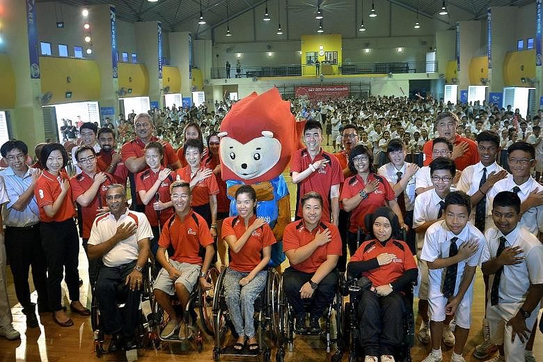 Minister for Culture, Community and Youth Grace Fu (middle row, fifth from left) and Senior Minister of State, Ministry of Culture, Community and Youth and Ministry of Finance Sim Ann (middle row, second from left) joined para-athletes yesterday to d