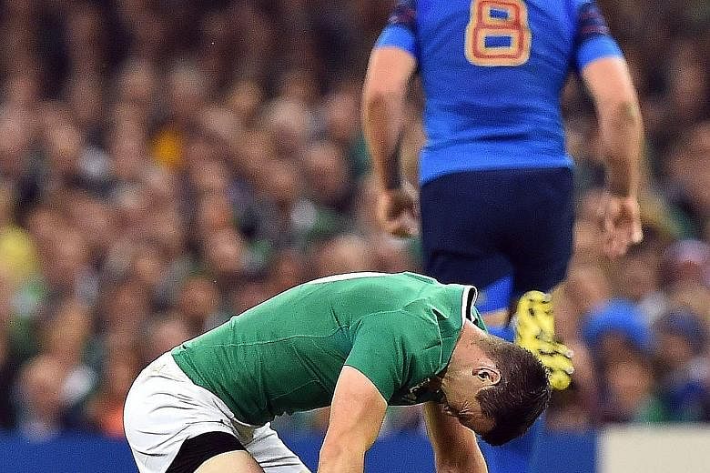 Ireland fly-half Jonathan Sexton reacting to a heavy tackle by France No. 8 Louis Picamoles before leaving the pitch injured during their crunch clash on Sunday. The tackle and the ruck are the most dangerous elements of the game and they are now und