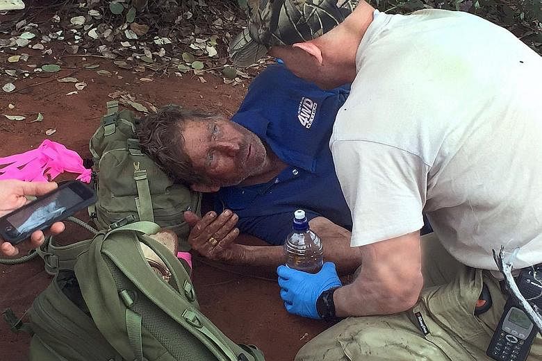 A police tracker comforting Mr Reg Foggerdy, 62, who disappeared on Oct 7 while heading on a hunting trip to the Shooter's Shack camp near Laverton in the West Australian goldfields, some 950km north-east of Perth. Mr Foggerdy survived for six days i