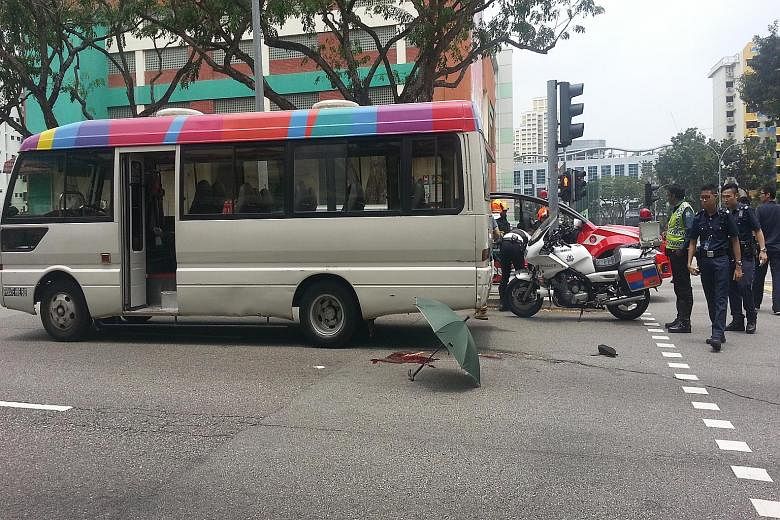 The accident scene at Toa Payoh Lorong 1, outside Braddell MRT Station, yesterday, when a woman was knocked down by a minibus. Her right leg was badly injured.