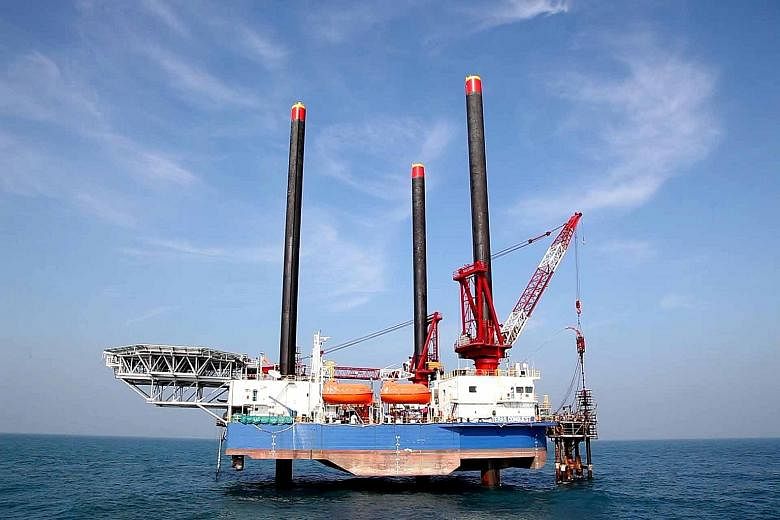 Local oil and gas-related companies remain relatively attractive potential assets for overseas firms as many have made a good name for themselves, including Ezion Holdings (left), one of the largest liftboat operators in the world.